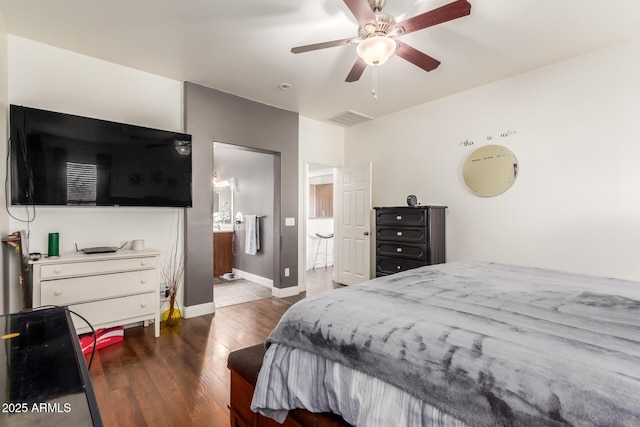 bedroom featuring dark hardwood / wood-style flooring, connected bathroom, and ceiling fan