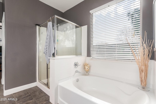 bathroom featuring tile patterned floors and shower with separate bathtub