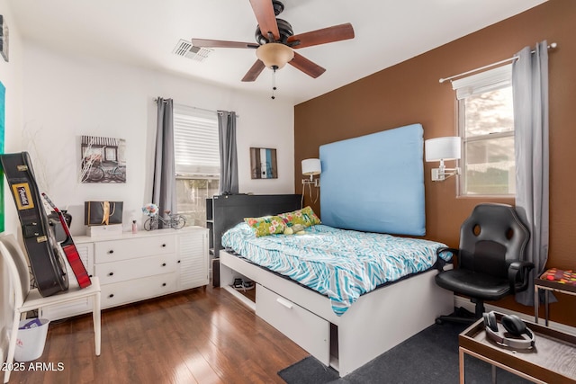 bedroom featuring dark wood-type flooring and ceiling fan