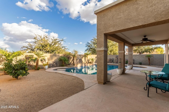 view of pool with ceiling fan and a patio area