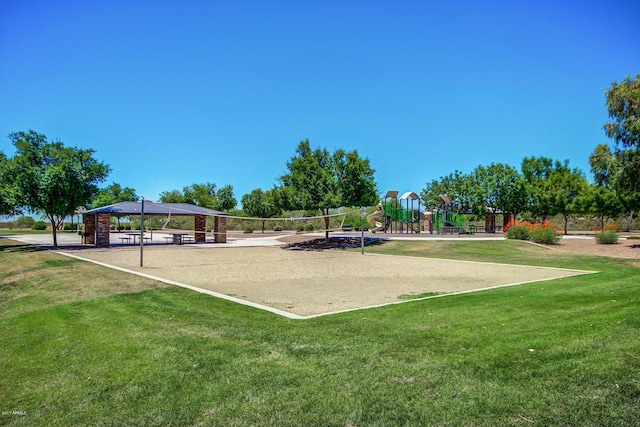 view of community featuring a yard, volleyball court, a playground, and a gazebo