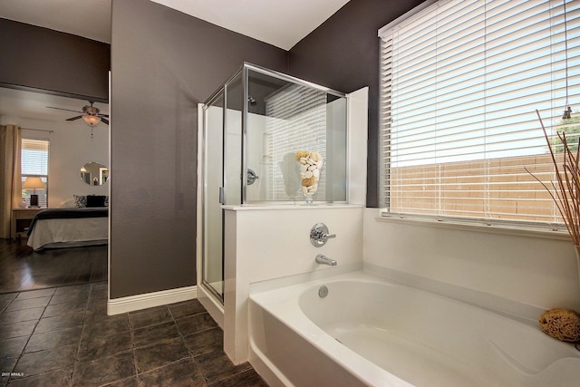 bathroom with plus walk in shower and ceiling fan