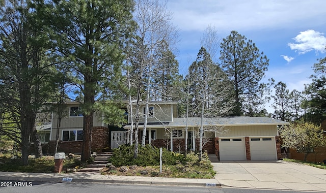 3530 N Monte Vista Dr, Flagstaff, AZ 86004 - view of front of property featuring brick siding, concrete driveway, a garage, and a shingled roof