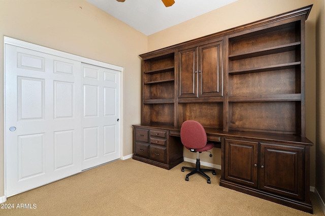 unfurnished office featuring carpet floors, baseboards, and a ceiling fan