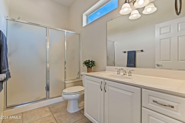 full bathroom with toilet, tile patterned flooring, vanity, and a shower with shower door