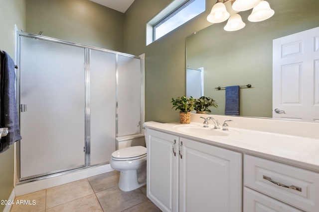 bathroom featuring a shower with door, vanity, a notable chandelier, toilet, and tile patterned floors