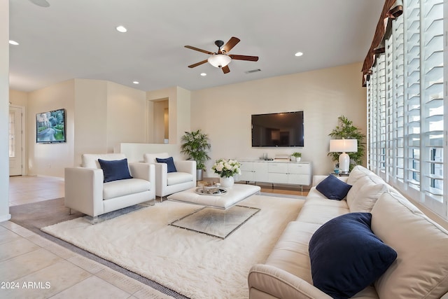 living room with ceiling fan, light tile patterned flooring, recessed lighting, visible vents, and baseboards