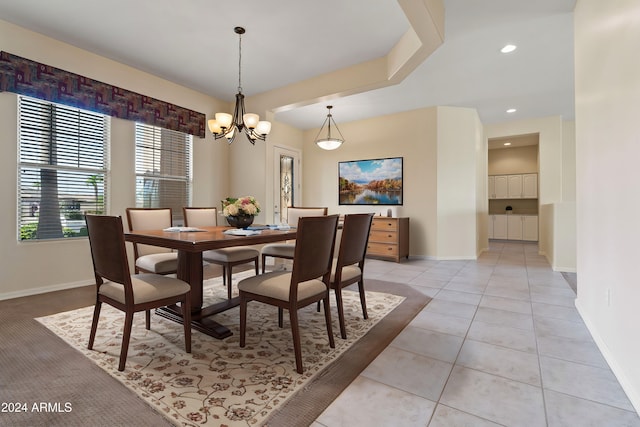 dining area featuring a notable chandelier, recessed lighting, light tile patterned flooring, and baseboards