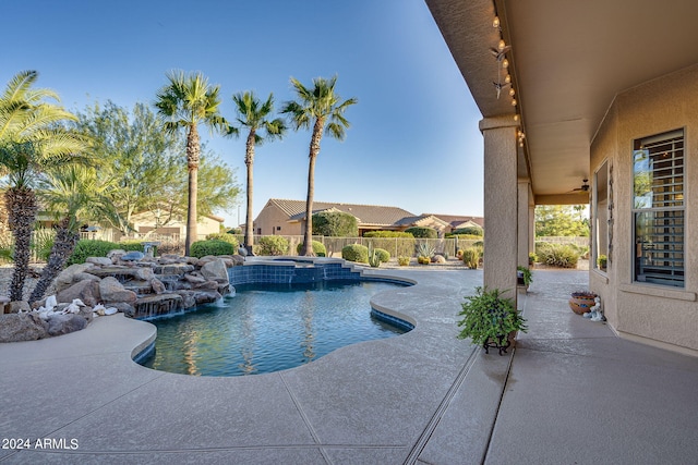 view of swimming pool featuring an in ground hot tub, a patio, and pool water feature