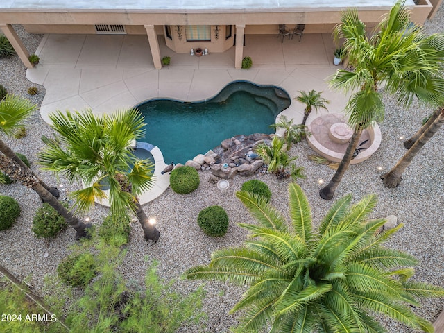 outdoor pool featuring a patio