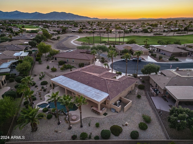 aerial view at dusk with a residential view and a mountain view