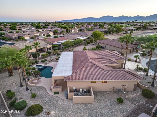 aerial view at dusk with a residential view and a mountain view