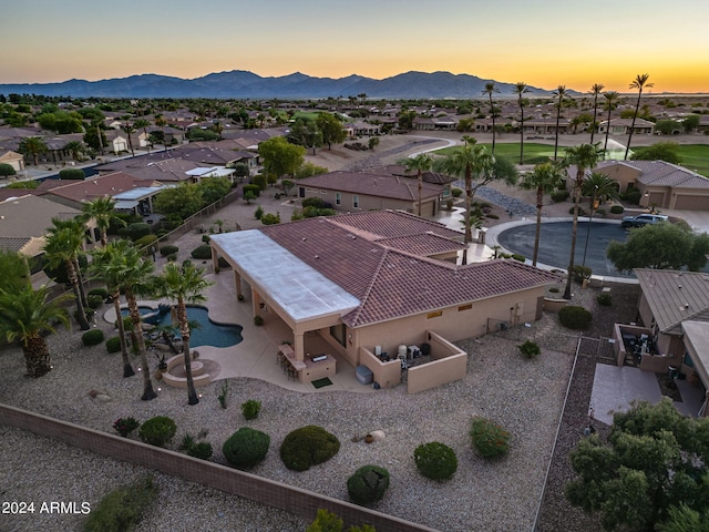 aerial view at dusk with a mountain view