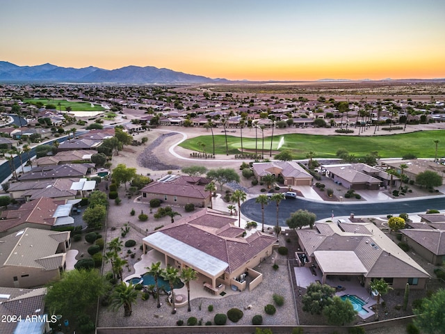 aerial view at dusk with a mountain view