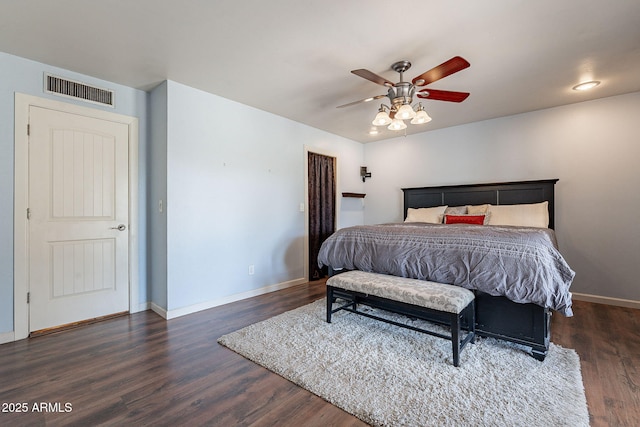 bedroom with ceiling fan and dark hardwood / wood-style floors