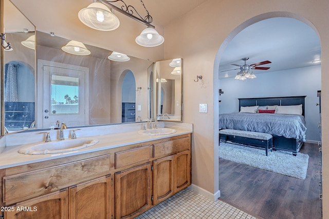 bathroom with vanity, hardwood / wood-style floors, and ceiling fan