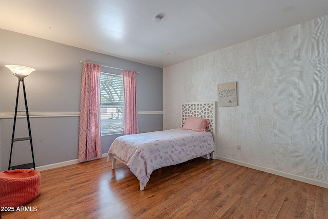 bedroom with hardwood / wood-style floors