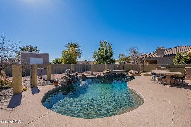 view of swimming pool featuring a patio and pool water feature