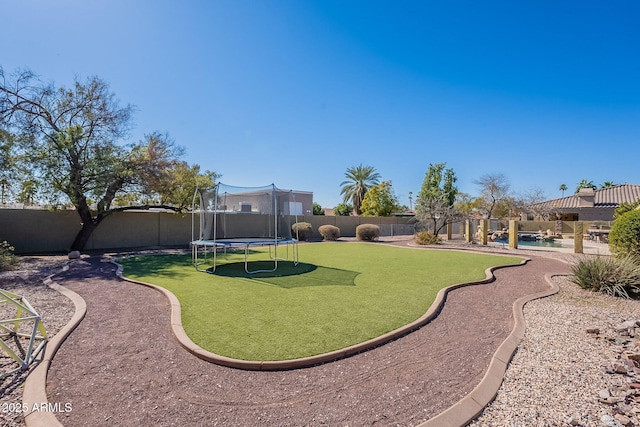 view of yard with a trampoline