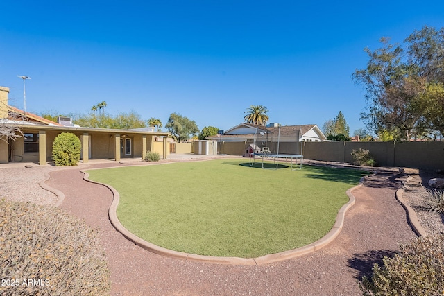 view of yard with a trampoline