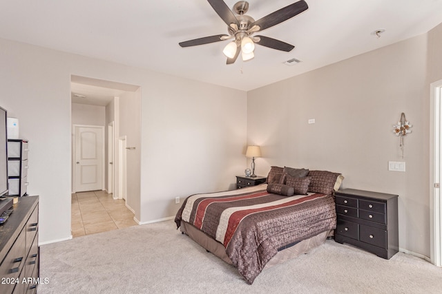 bedroom with light carpet and ceiling fan