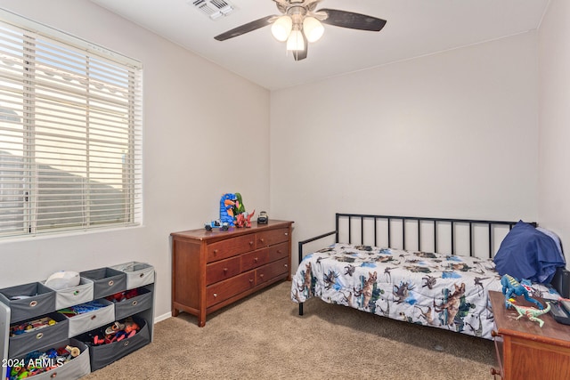 carpeted bedroom with ceiling fan