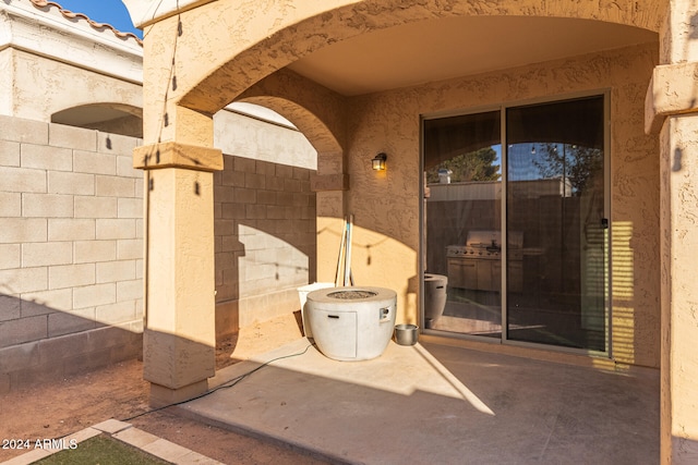 doorway to property featuring a patio area