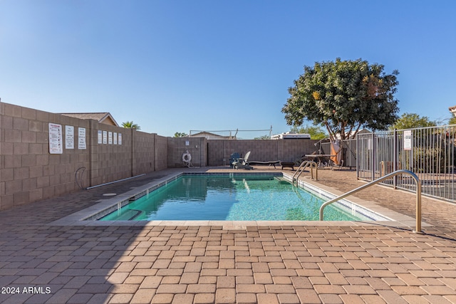 view of pool featuring a patio