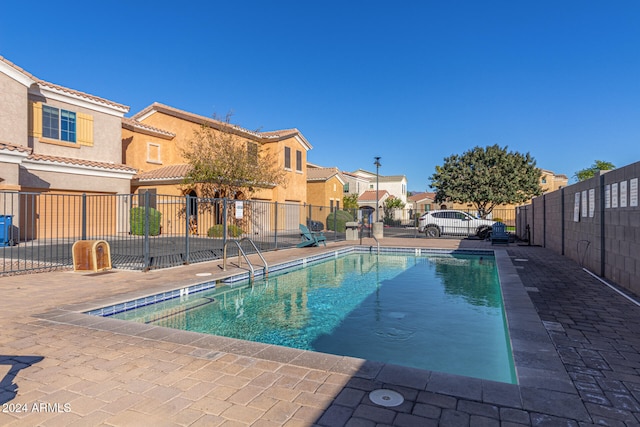 view of swimming pool with a patio