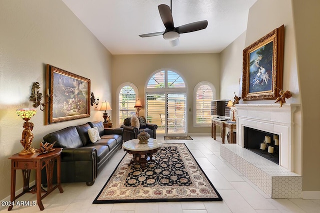 tiled living room with ceiling fan