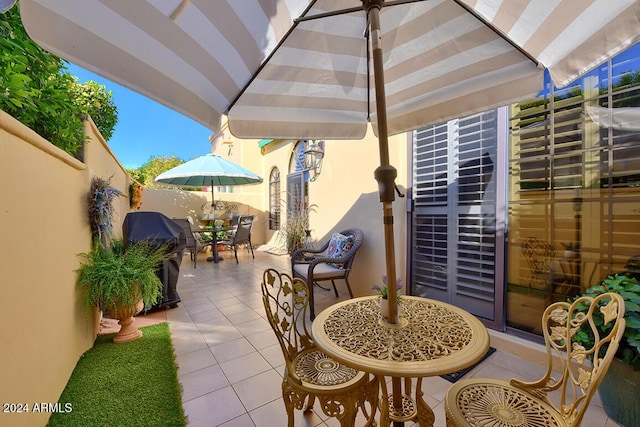 view of patio featuring a grill