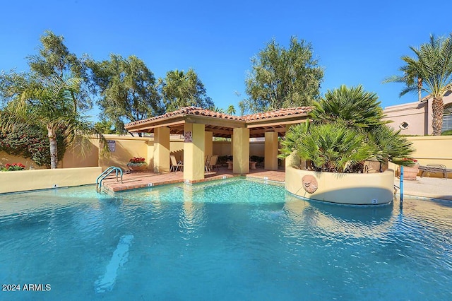 view of swimming pool featuring a patio area