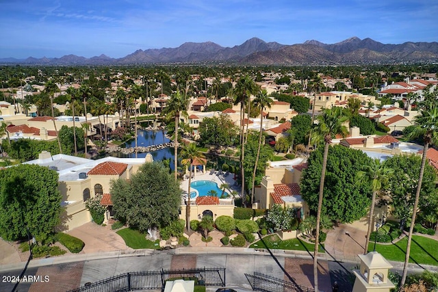 birds eye view of property with a mountain view