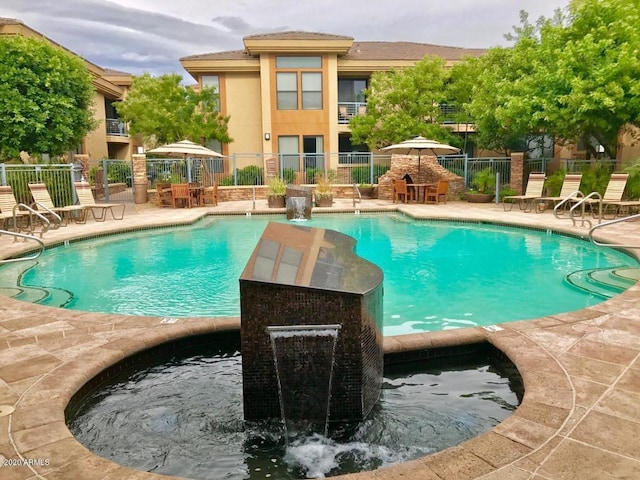 view of swimming pool with a patio area