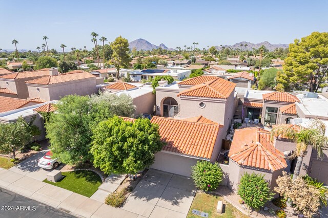 birds eye view of property featuring a mountain view