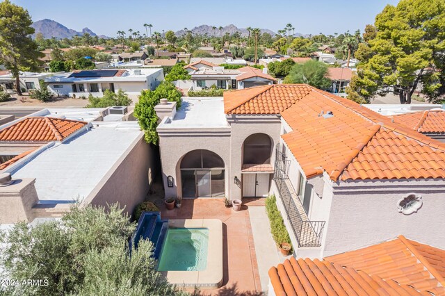 birds eye view of property with a mountain view