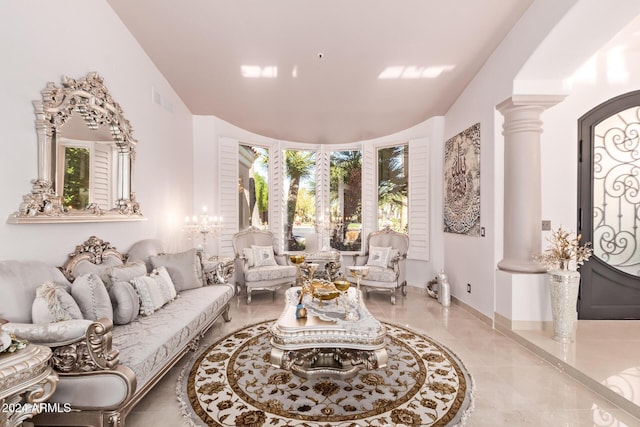 living room with ornate columns