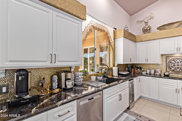 kitchen with dishwasher, dark stone counters, sink, wine cooler, and white cabinetry