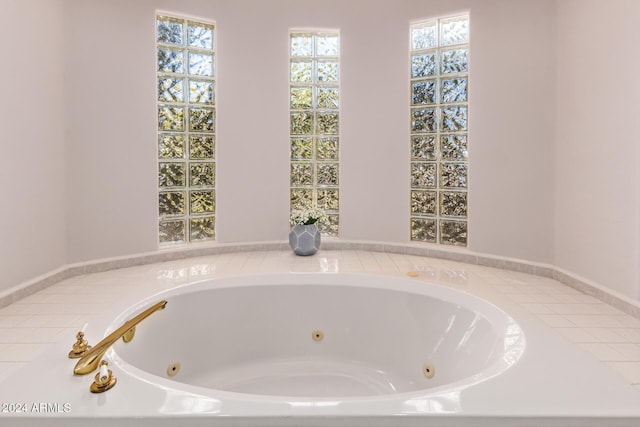 bathroom with a bath and a healthy amount of sunlight