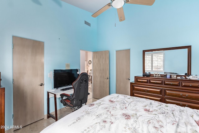 bedroom with a high ceiling and ceiling fan