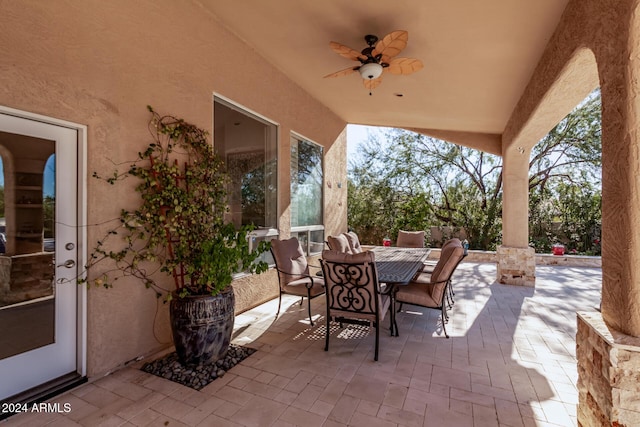 view of patio featuring ceiling fan