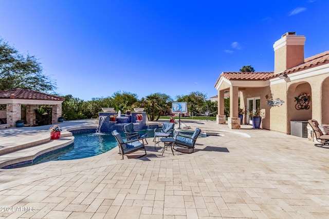 view of swimming pool with a gazebo, a patio, and pool water feature