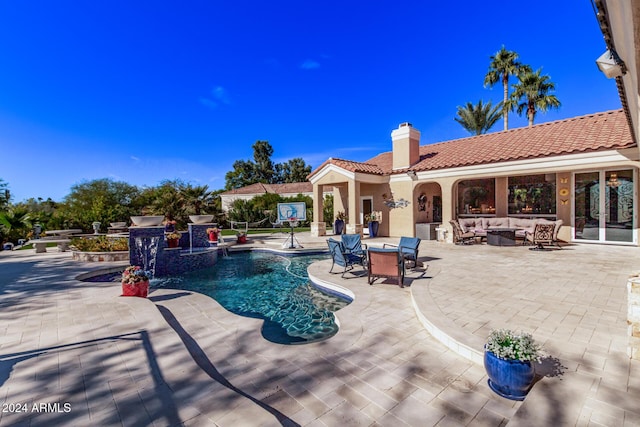 view of swimming pool featuring outdoor lounge area and a patio area