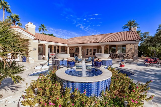 rear view of property with a patio