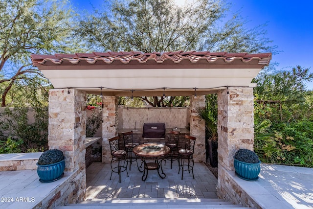 view of patio / terrace featuring a gazebo and grilling area