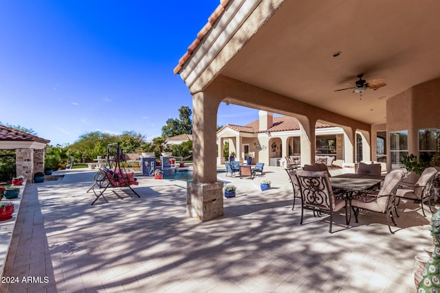 view of patio / terrace featuring ceiling fan