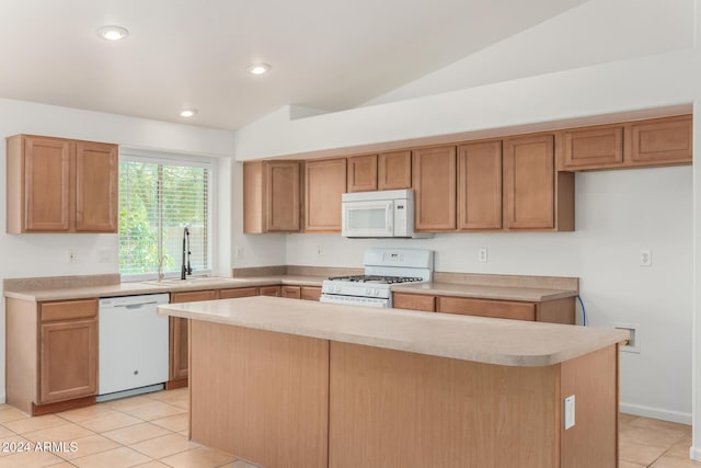 kitchen featuring white appliances, recessed lighting, a sink, light countertops, and a center island