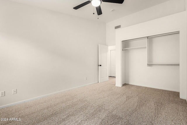 unfurnished bedroom with a closet, baseboards, carpet, and visible vents