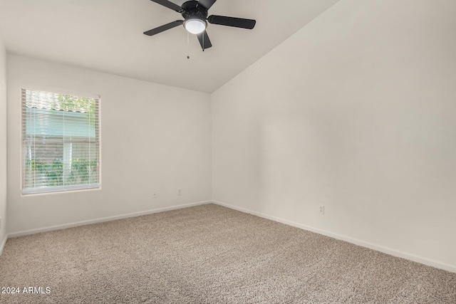 unfurnished room featuring vaulted ceiling, baseboards, ceiling fan, and carpet floors