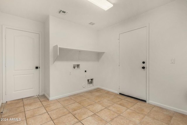 clothes washing area featuring hookup for a washing machine, visible vents, gas dryer hookup, laundry area, and electric dryer hookup